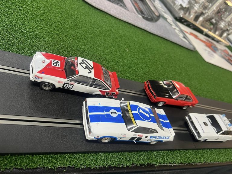 Scalextric slot cars racing on the track