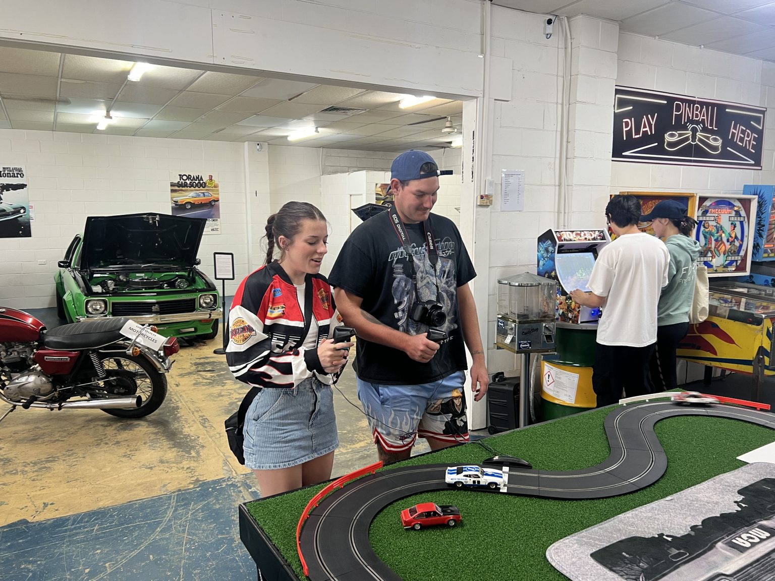 Visitors gathered around the Scalextric slot car track
