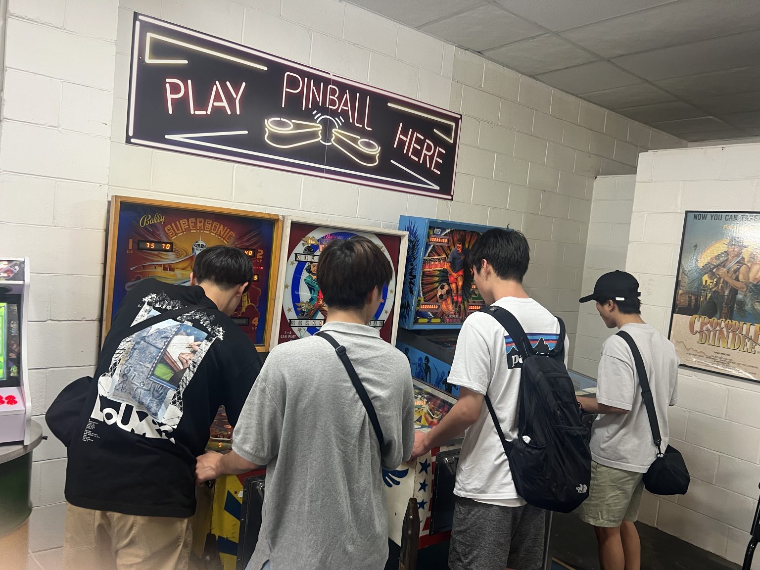 Visitors exploring the pinball arcade
