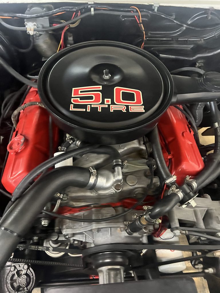 Holden SL/R engine bay with red rocker covers