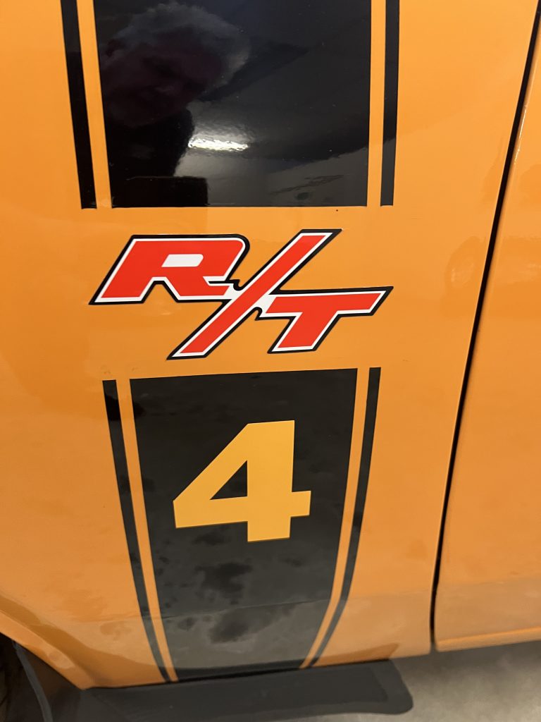 Orange Valiant Charger R/T with a number 4 decal