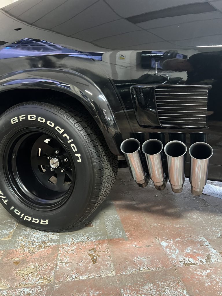 Chrome side exhaust pipes and BF Goodrich tyre on the Interceptor
