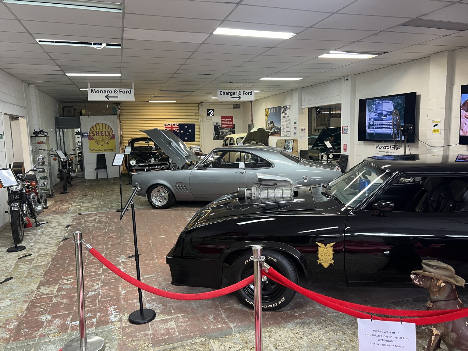The museum floor with the Mad Max Interceptor behind a red rope