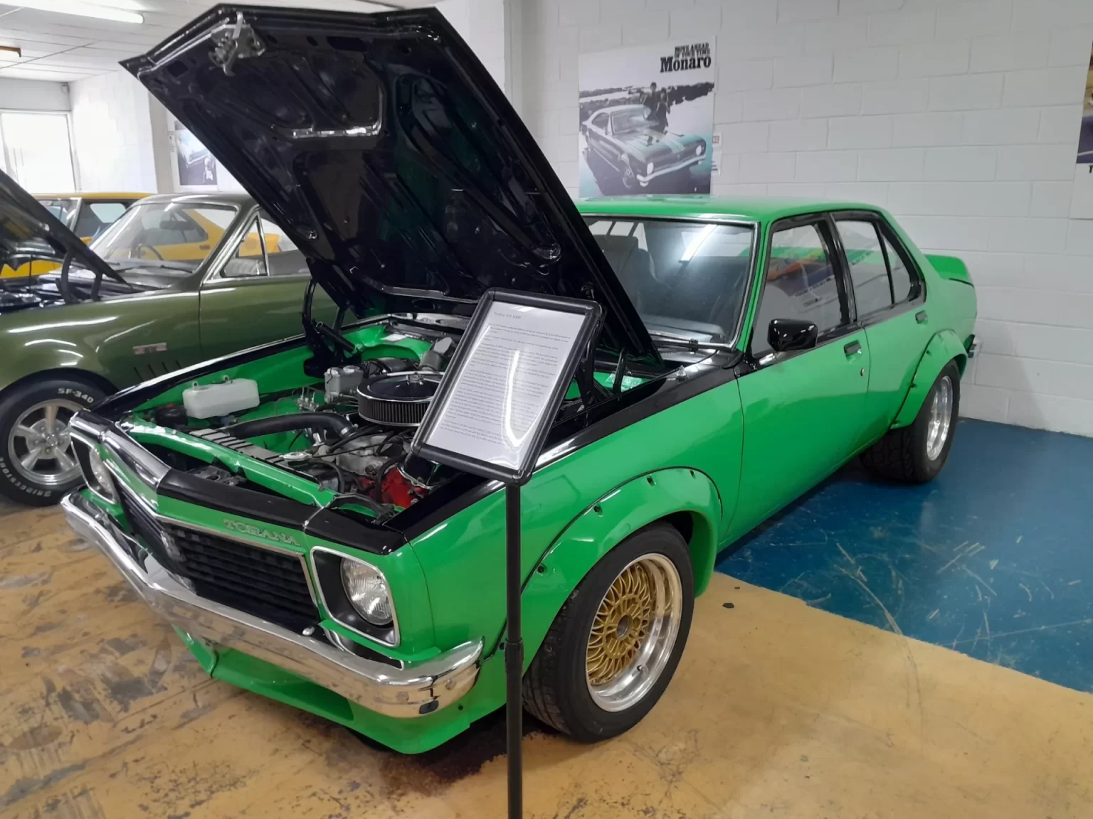 Green Holden Torana with its bonnet open